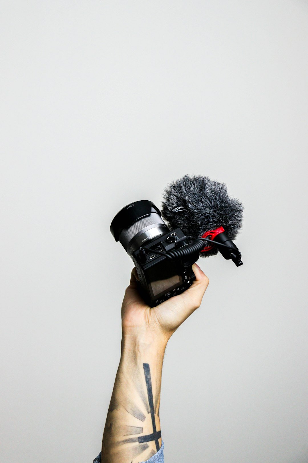 Journalist holding a microphone during an on-camera interview